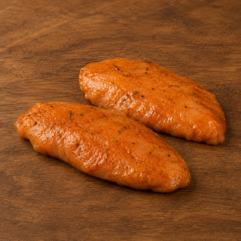 Gemarineerde Kipfilet van Pure Meat & Co, gemarineerde kipfilet op een snijplank